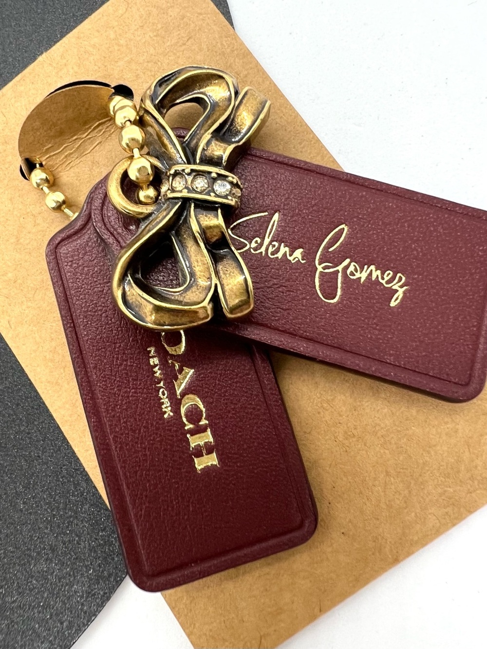 Authentic Coach x Selena Gomez Oxblood Leather Hangtag Bow Bag Charm